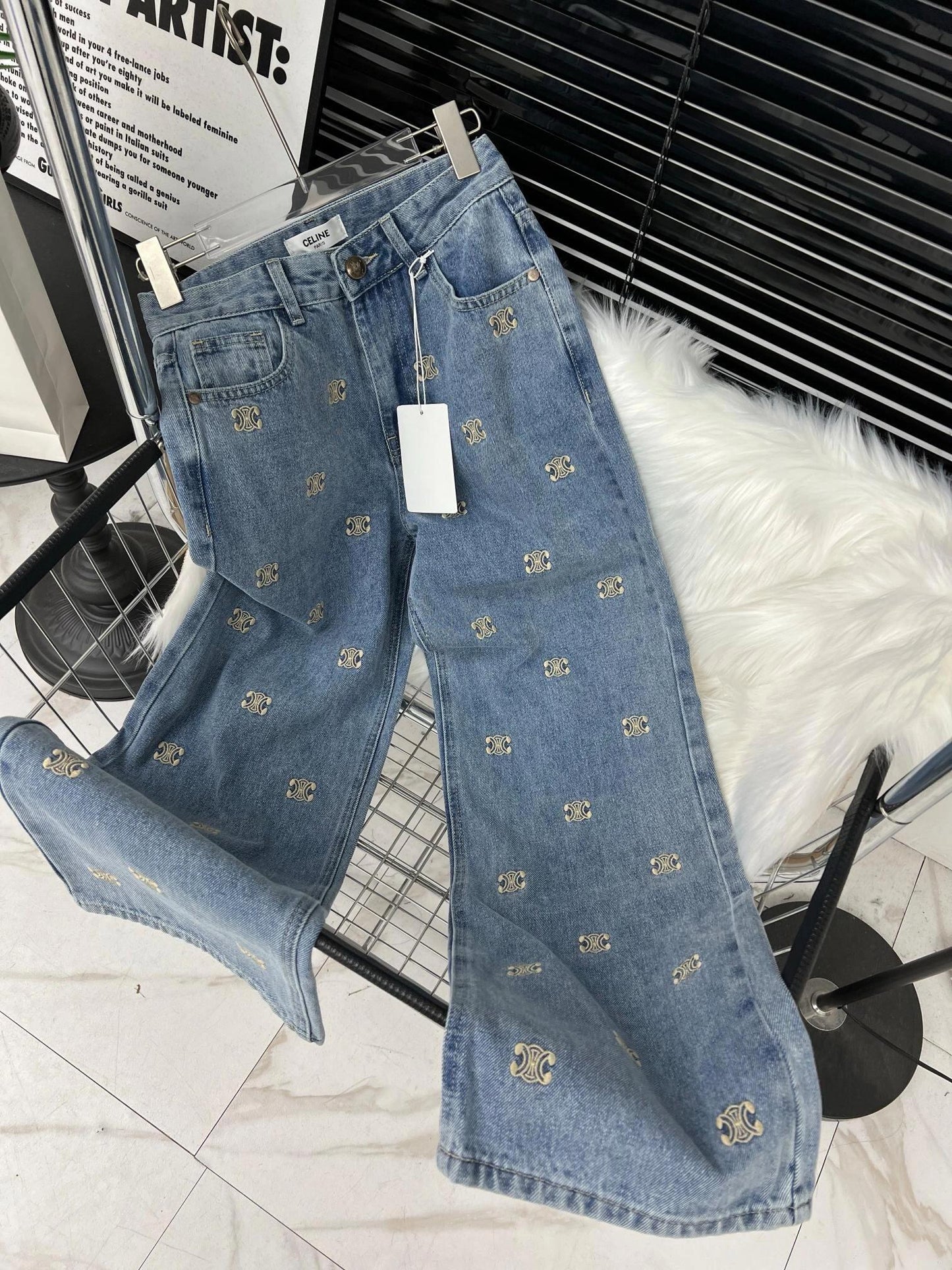 Denim trousers with all-over logo embroidery