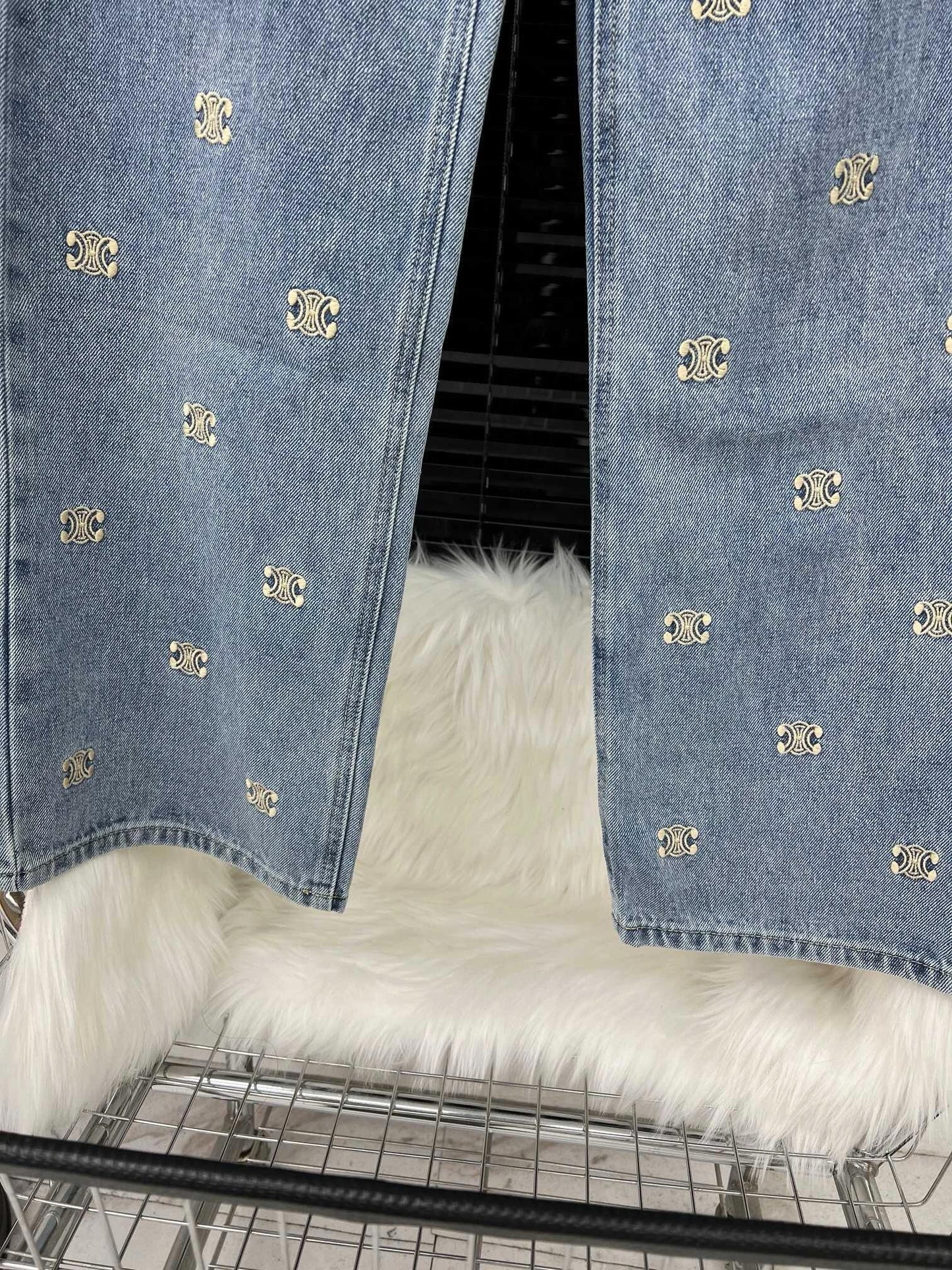 Denim trousers with all-over logo embroidery